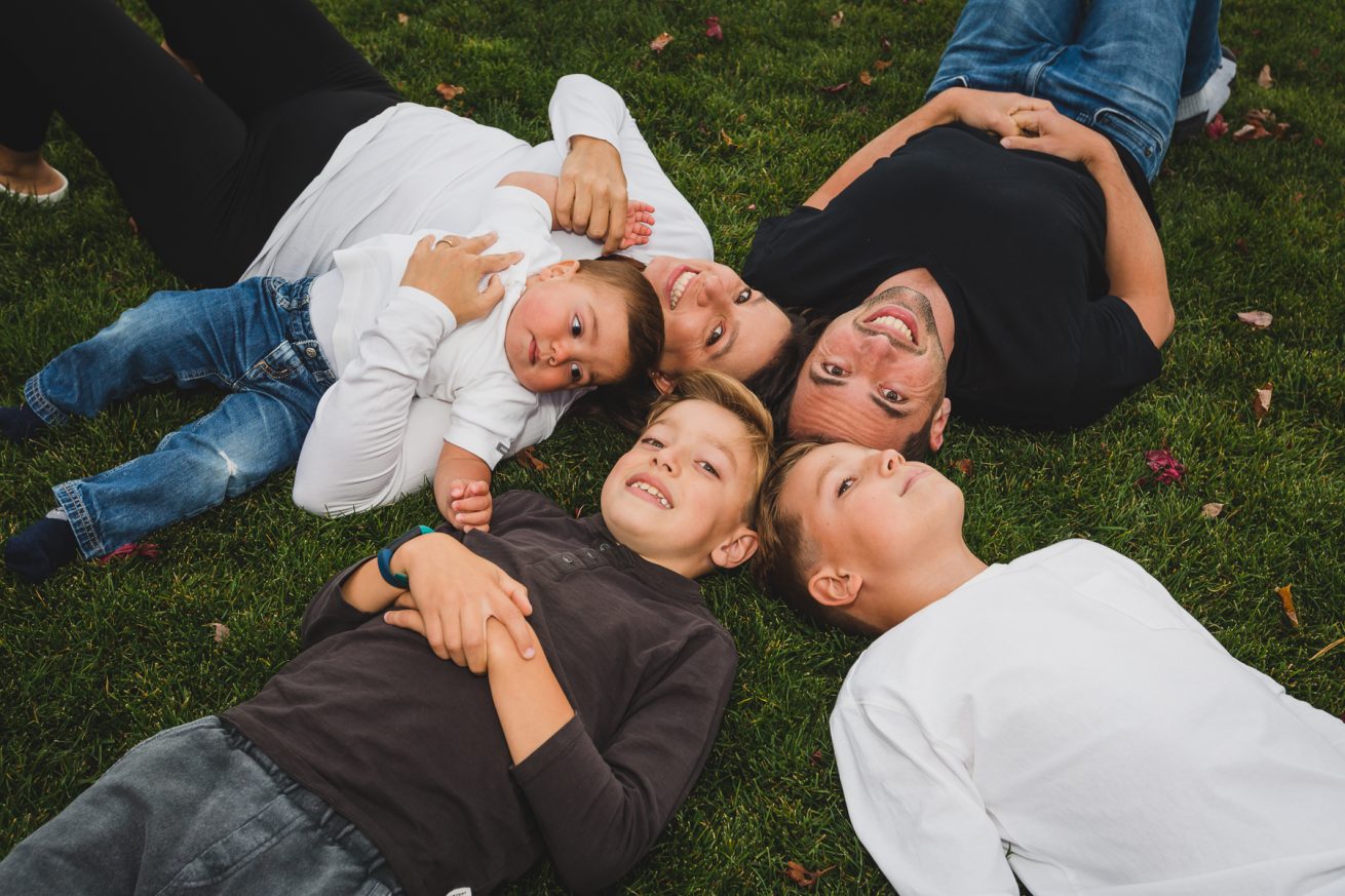 Family laying on the grass